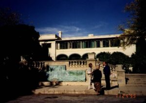 the Anokia building with a group of people standing in front of it
