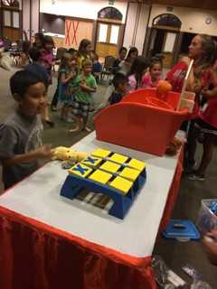 fall 2 a child playing a giant tic tac toe came