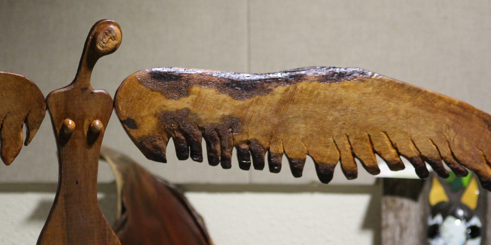 a wood sculpture of an angel