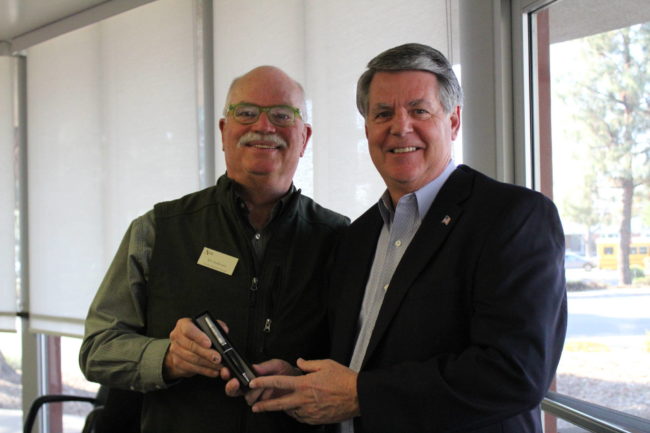 IMG_2000 two men holding a pen