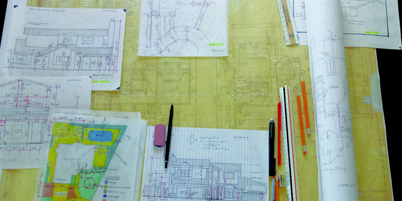 Erenay Design Build single home project in Arcadia showing blueprints laid out on a table