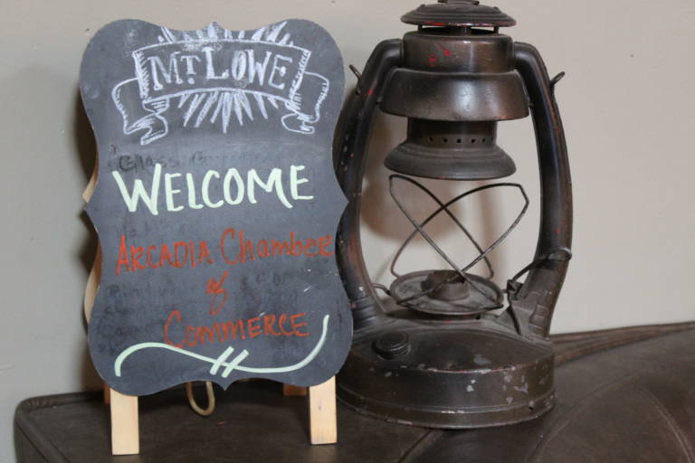 a sign welcome Chamber members set beside an old lamp at Mt Lowe Brewing Co
