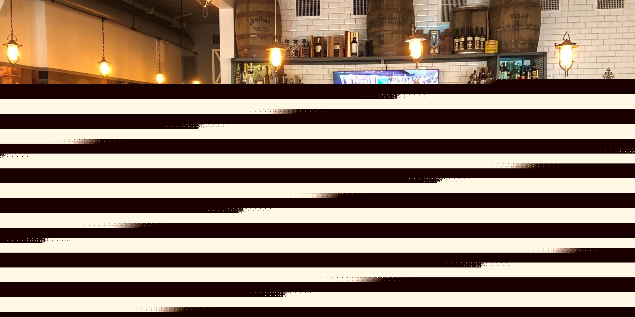 a group of people in a restaurant watching a sports game