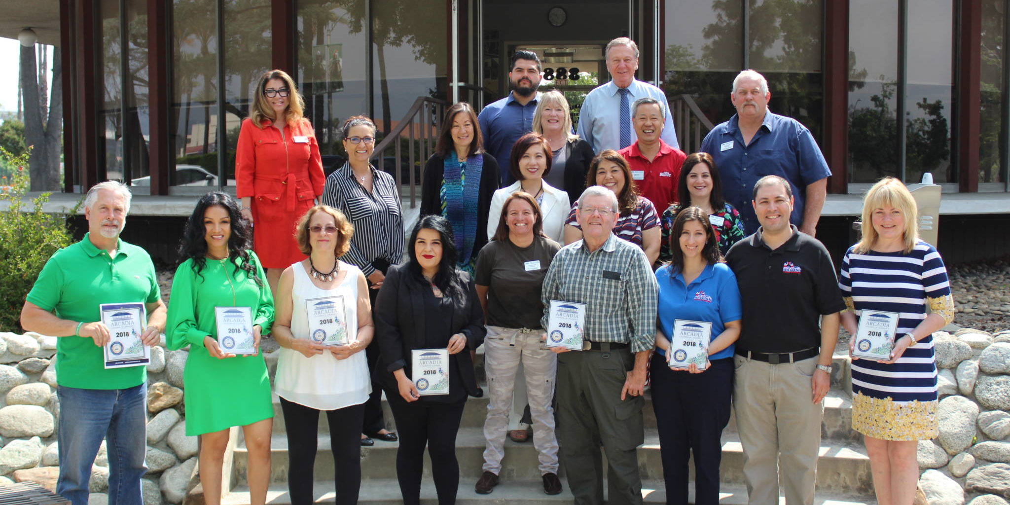 IMG_1332 a group of people standing on the back steps of the Arcadia Chamber building