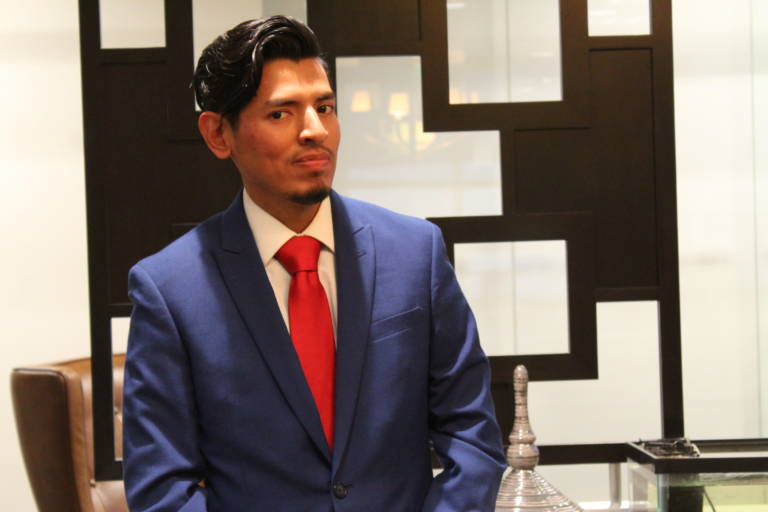 IMG_2944 a man in a blue suit looking suave with a red tie