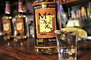 Max's Mexican Cuisine brand name tequila bottle with shot glass