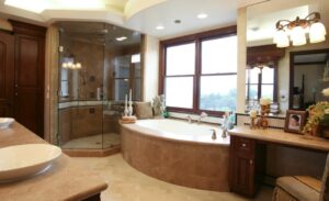 bathroom with a tub and shower done by Romani Construction 