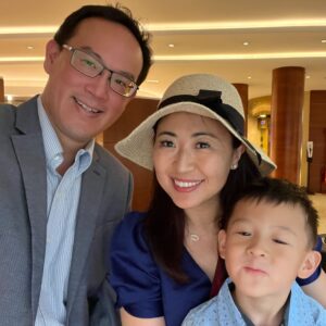 Dr William Tseng from City of Hope with his wife who is wearing a hat and young son 