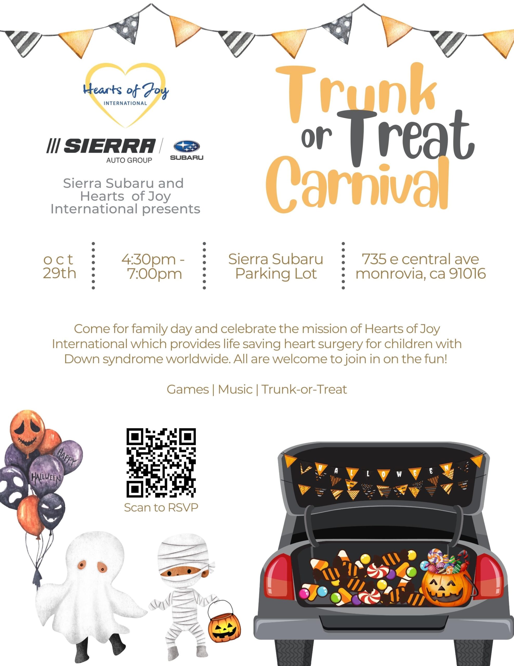 Sierra Subaru trunk or treat carnival with halloween balloons and a car showing the trunk open with treats 