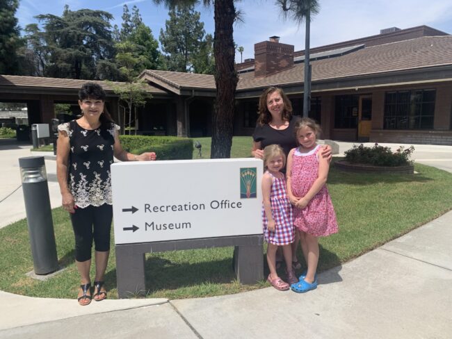 a group of women holding a large check for Arcadia Community Coordinating Council