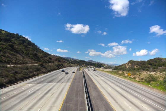 a freeway with a blue sky