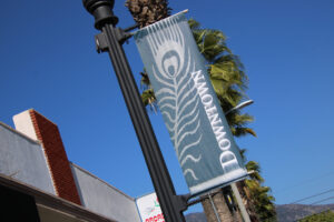 sign for Downtown Arcadia with peacock feather