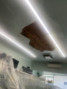 a hole in the ceiling of a restaurant 