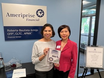 Francine Chiu and Roberta Armijo posing with a chamber plaque