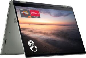 a folded laptop computer with an image showing the ocean