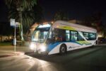a Foothill Transit bus on the road in the dark 