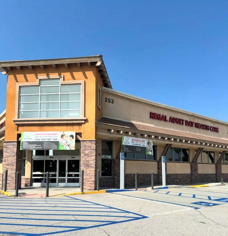 entrance to Regal Adult Medical building showing parking lot with handicap crossings