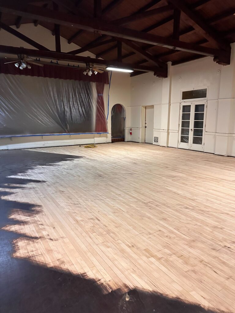 the ballroom of the Arcadia Woman's Club with the hardwood floors stripped and sanded