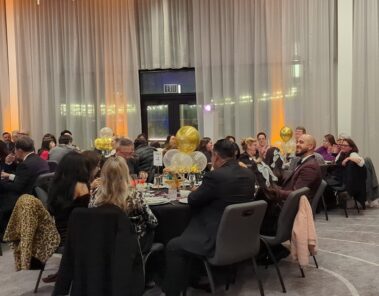 a ballroom filled with seated people