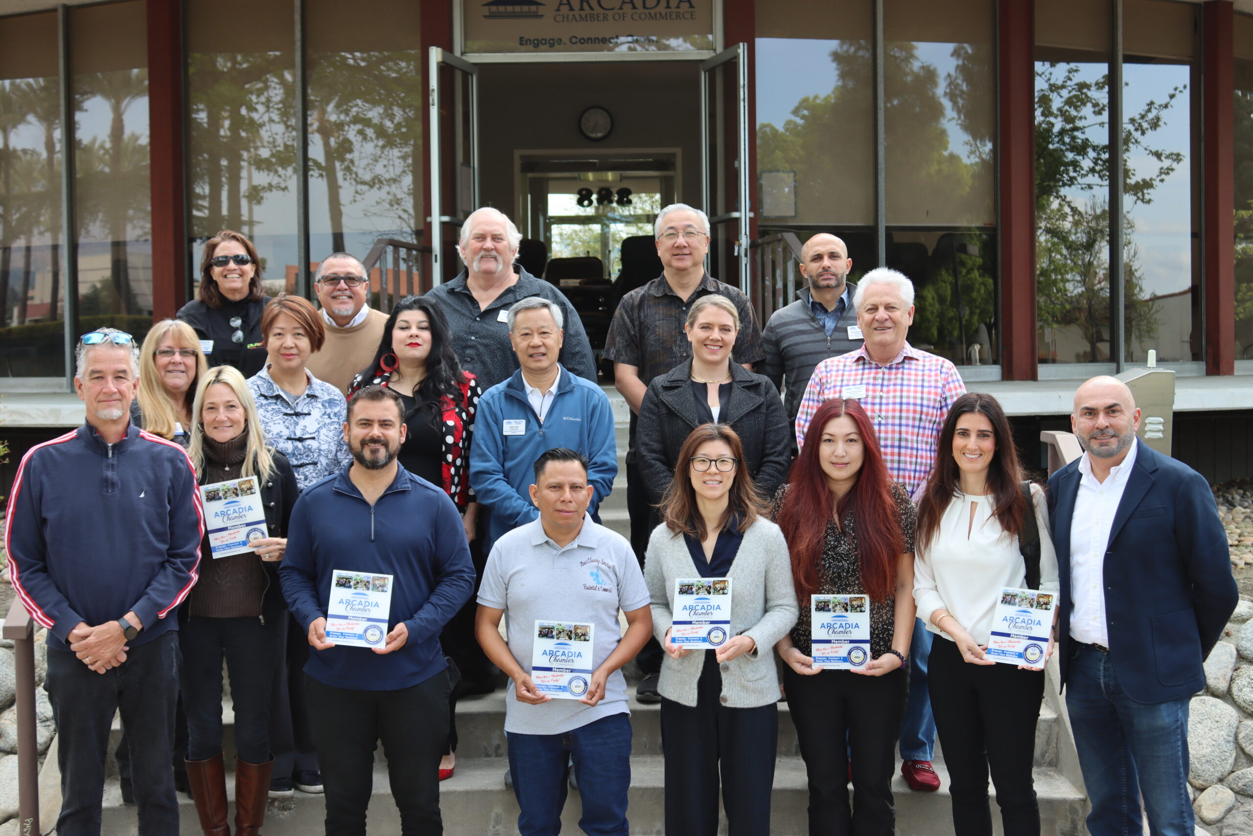 a large group of Arcadia Chamber ambassadors and new members posing on some steps
