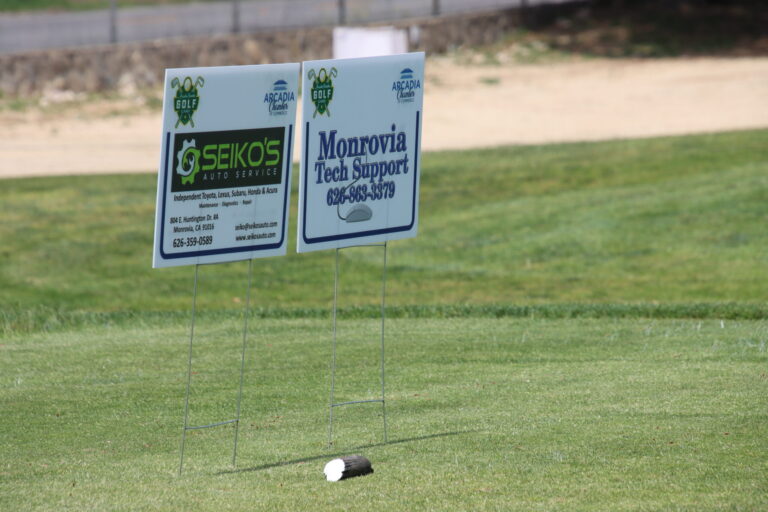 a tee sign for Seiko's Auto alongside a tee sign for Monrovia Tech Support