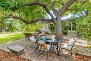 Baldwin Stocker open house from Sue Cook showing a patio under a tree 