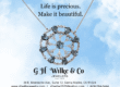GH Wilke make it beautiful flyer showing a round pendant on a necklace against a blue sky