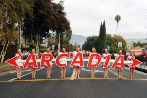the Arcadia High color guard holding large letters that spell out Arcadia