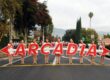the Arcadia High color guard holding large letters that spell Arcadia