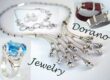 Dorano Jewelry banner showing silver necklace, a ring with a blue stone and bracelets