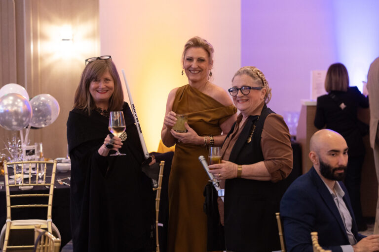 three women in star wars outfits holding out their glasses