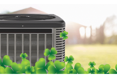 an air conditioner unit surrounded by shamrocks