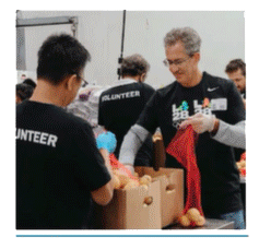 Volunteers packing boxes.