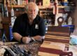 David Lamb in his workshop showing off cutting boards