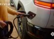 a person charging their Rivian car