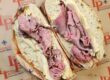 a pastrami sandwich from Little Provence on paper stamped with their logo