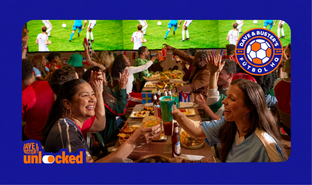 a group of people around a table celebrating a World Cup game at Dave & Buster's 