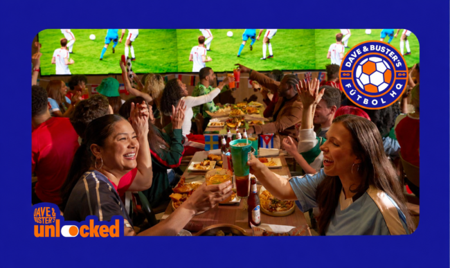 a group of people around a table celebrating a World Cup game at Dave & Buster's