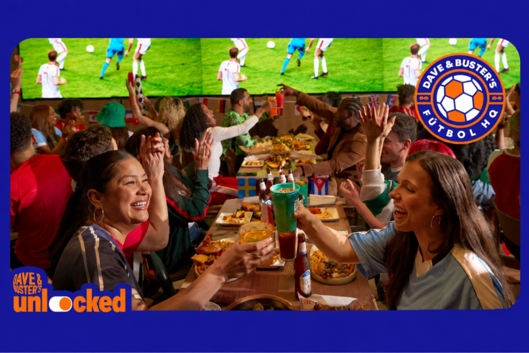 a group of people around a table celebrating a World Cup game at Dave & Buster's