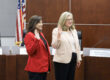 two women hold up their hands to be sworn in for the Arcadia Unified School District board of education