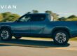 a Rivian RT pickup driving on the road