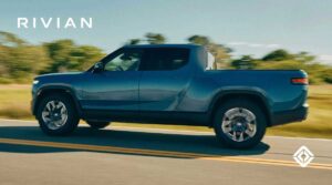 a Rivian RT pickup driving on the road
