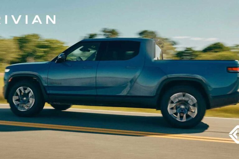 a Rivian RT pickup driving on the road