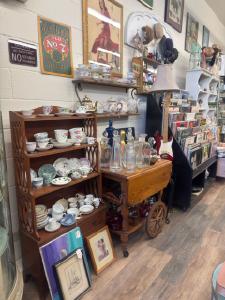 a rack of vintage items in an antique store