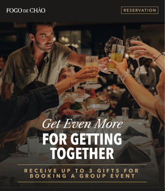 a group of people at Fogo de Chao raising glasses to cheers over a spread of food 